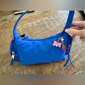 New Blue Nylon Handbag with Charm Accents and Side Pockets